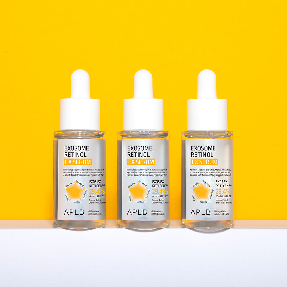 APLB Exosome Retinol EX Serum 40ml, flacons APBL sur fond jaune vif, contexte visuel studio beauté