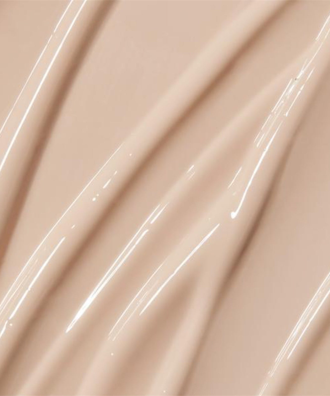 Crème légère APRILSKIN Tone-Up Skin Tint texture en gros plan, offrant une base parfaite pour un teint lumineux et uniforme.