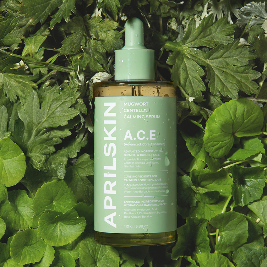 APRILSKIN Centella Calming Ampoule 110g de la marque APRILSKIN, flacon vert sur fond de feuilles de centella.