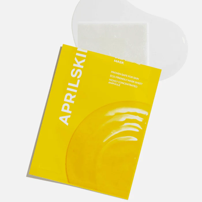 Décris l'image en français : APRILSKIN Real Calendula Deep Essence Mask, masque facial en sachet jaune, sur fond blanc.