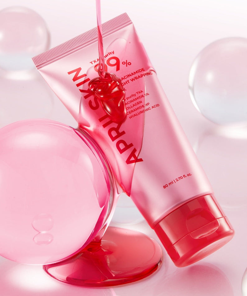 APRILSKIN TXA Niacinamide 99 Deep Cleanser 120g de marque APRILSKIN, tube rose sur fond bulles, contexte visuel skincare