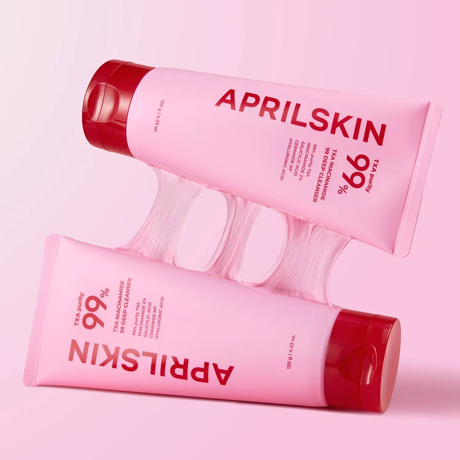 APRILSKIN TXA Niacinamide 99 Deep Cleanser 120g sur fond rose, pack et flacons visibles (marque APRILSKIN).