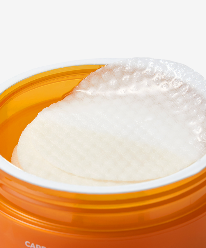 APRILSKIN Carrotene Clarifying Vita Pad, patch éclaircissant d’APRILSKIN, photo en pot orange sur fond clair
