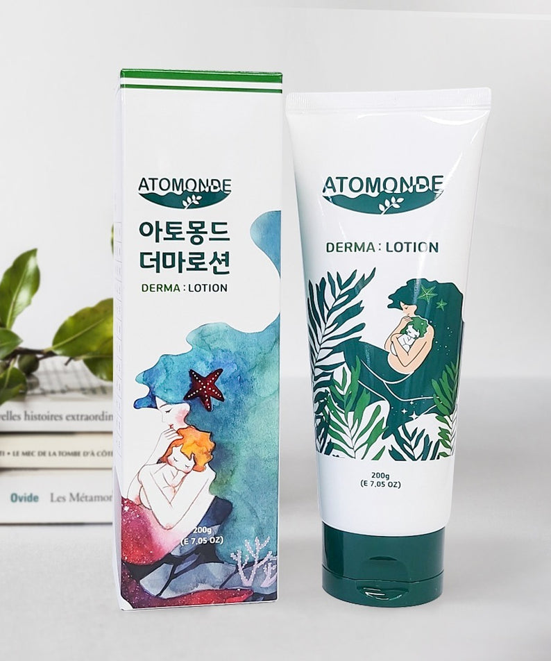 ATOMANDE Baby Derma Infant Lotion 200g, lotion bébé ATOMONDE en tube et packaging, décor avec feuilles et fond blanc