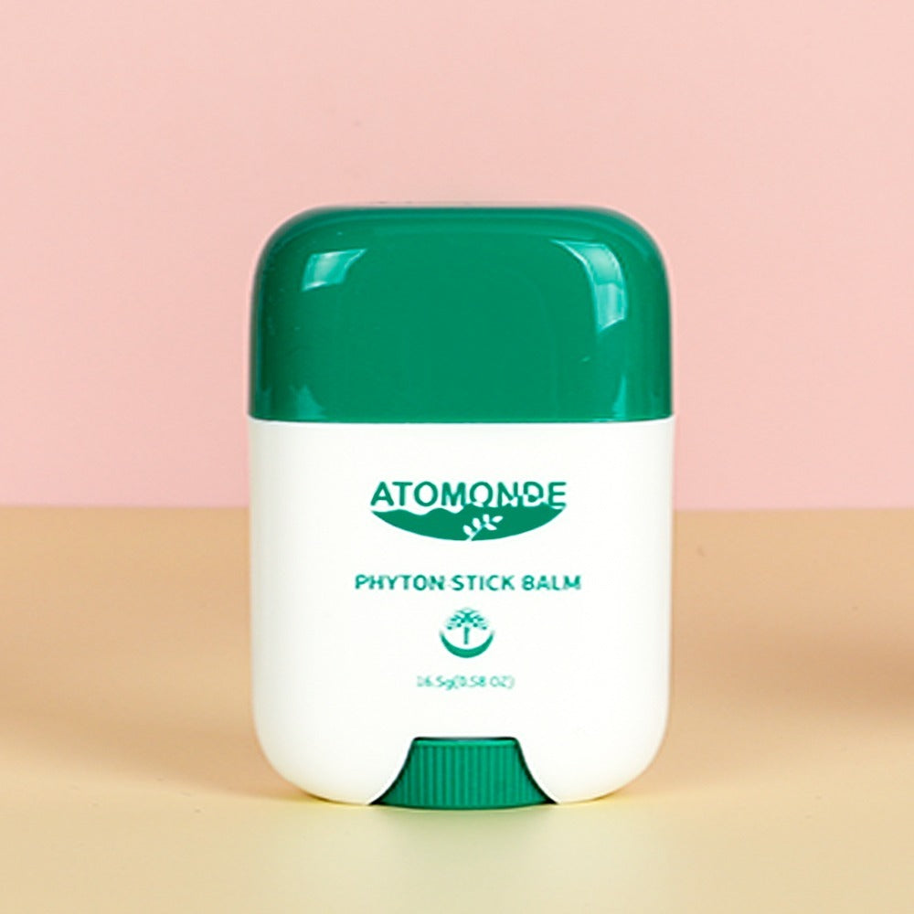 ATOMANDE Phyton Stick Balm 16.5g 1ea : baume stick vert sur fond rose et beige, présentation produit de la marque