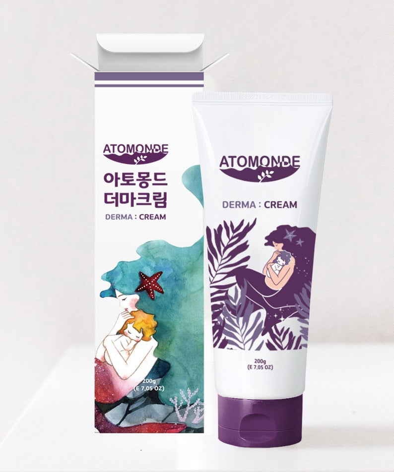Crème pour bébé ATOMANDE Baby derma Infant Cream 200g en tube blanc, 200g, emballage coloré derrière, soin de la peau délicate.