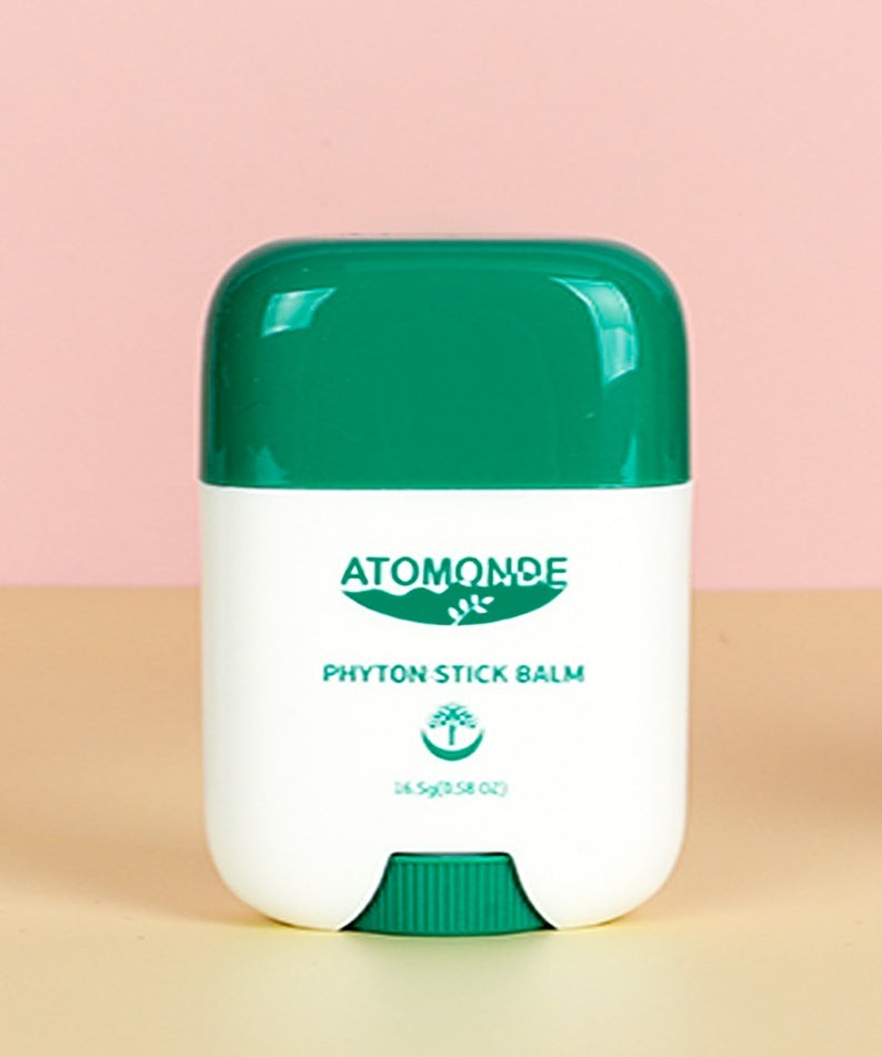 ATOMANDE Phyton Stick Balm 16.5g 1ea sur fond rose et jaune, produit soin naturel.