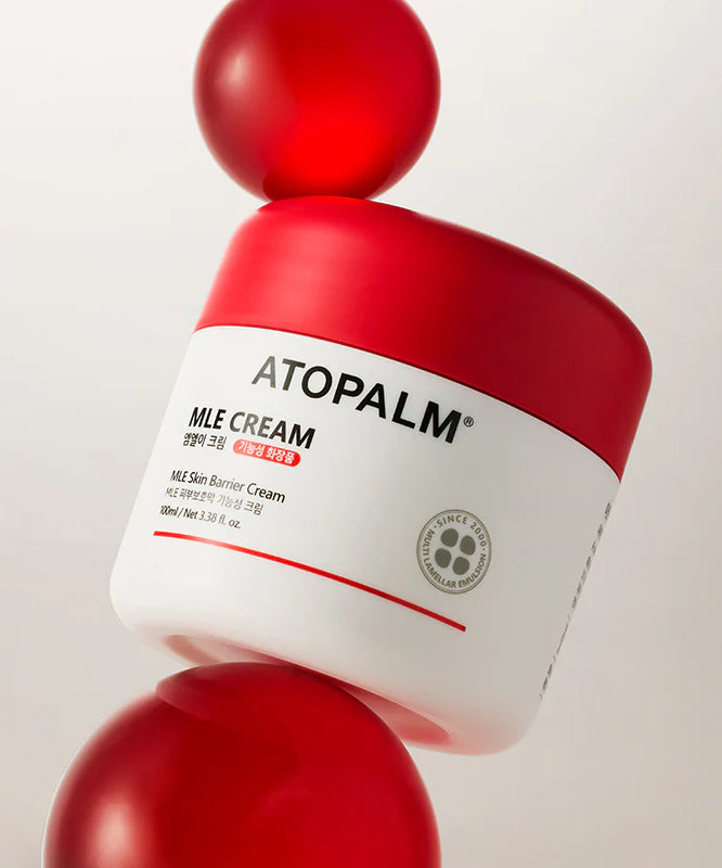 Décris l’image en français : ATOPALM MLE Cream 160ml (Single Type) sur fond blanc, flacon rouge et étiquette marque.