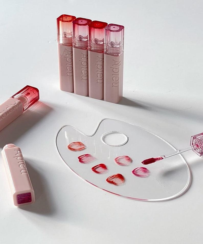 A'PIEU Juicy Pang Jelly Tint, teintes variées sur une palette, maquillage lèvres élégant et éclatant, rouge à lèvres tendance.