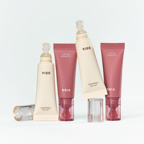 BBIA Lip Oil Essence en flacons crème et rose sur fond blanc, photo produit de la marque BBIA