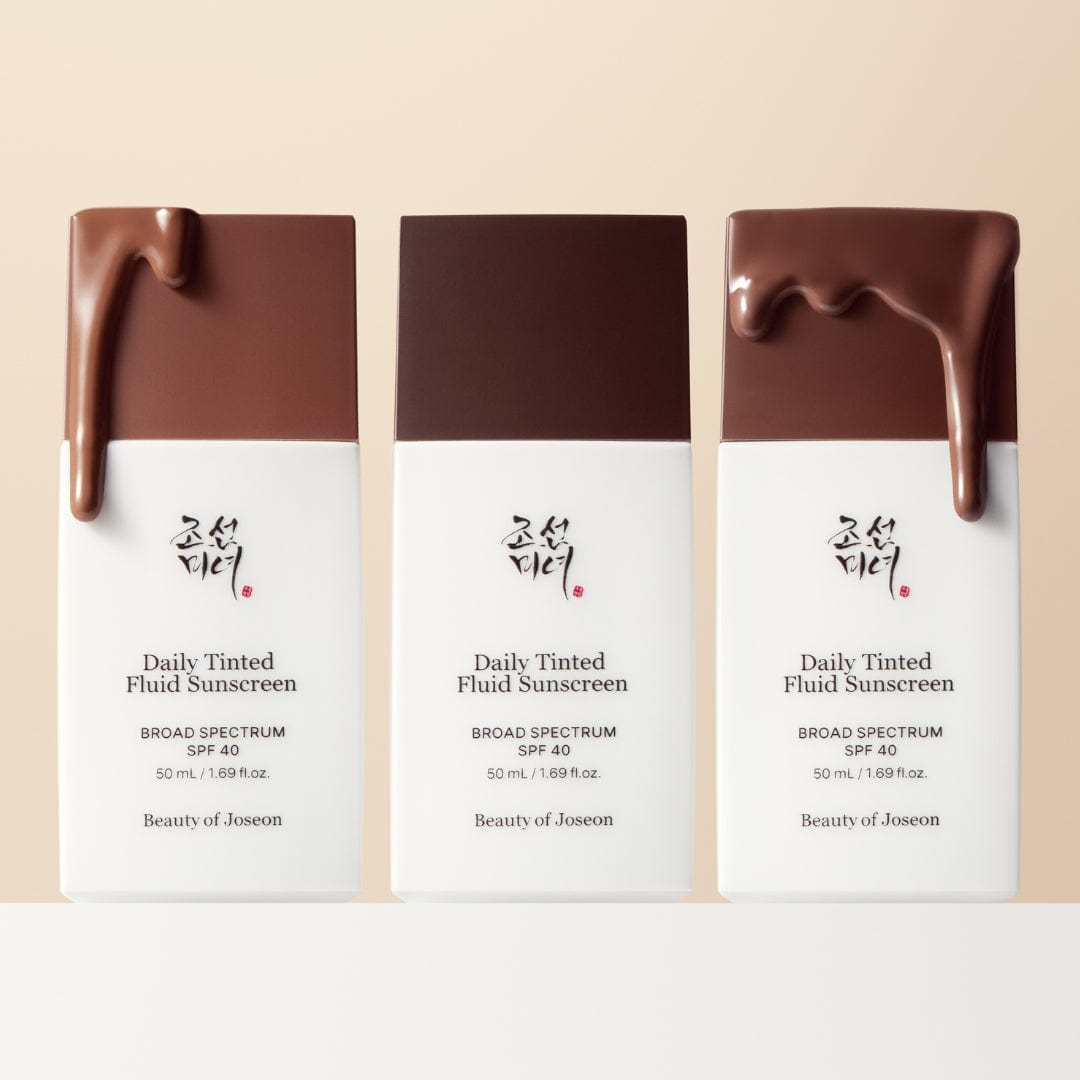 BEAUTY OF JOSEON Daily Tinted Fluid Sunscreen 50ml : trio de flacons teintés sur fond clair, marque Beauty of Joseon, visuel produit.