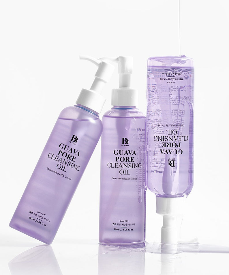 Décris l'image en français : BENTON Guava Blackhead Pore Cleansing Oil 200ml, flacons violets sur fond blanc