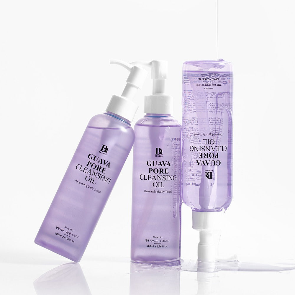 Décris l'image en français : BENTON Guava Blackhead Pore Cleansing Oil 200ml, flacons violets sur fond blanc