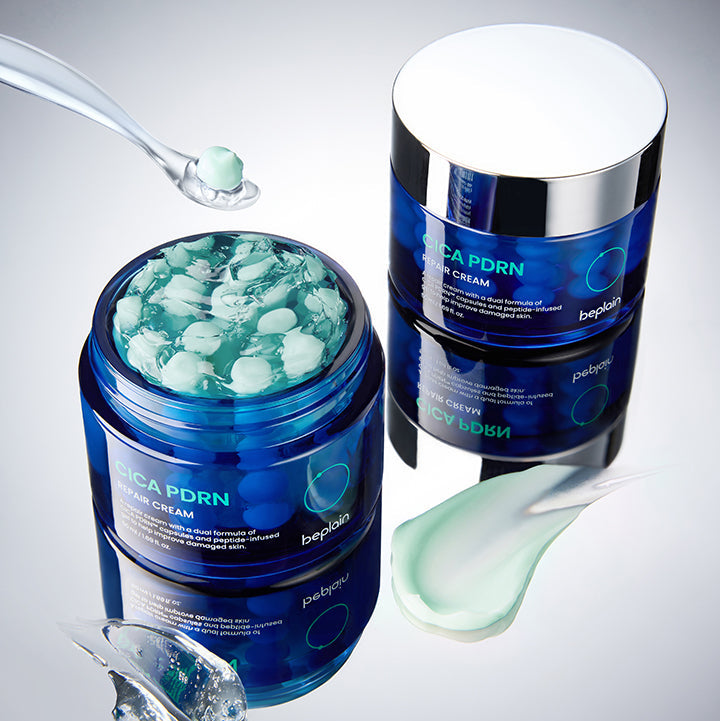 BEPLAIN Cica PDRN Repair Cream 50ml, pots bleus et crème verte sur fond blanc, contexte beauté et soin du visage.
