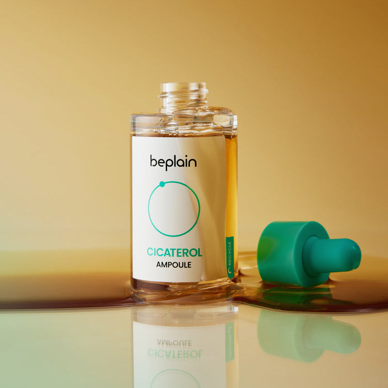 BEPLAIN Cicaterol Ampoule 30ml de Beplain en flacon, fond jaune; amboules et reflet sur table.