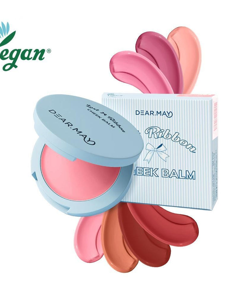 Cosmétique vegan tendance, DEAR MAY Lost Ribbon Check Balm, en couleurs vibrantes avec boîtier à ruban emblématique.