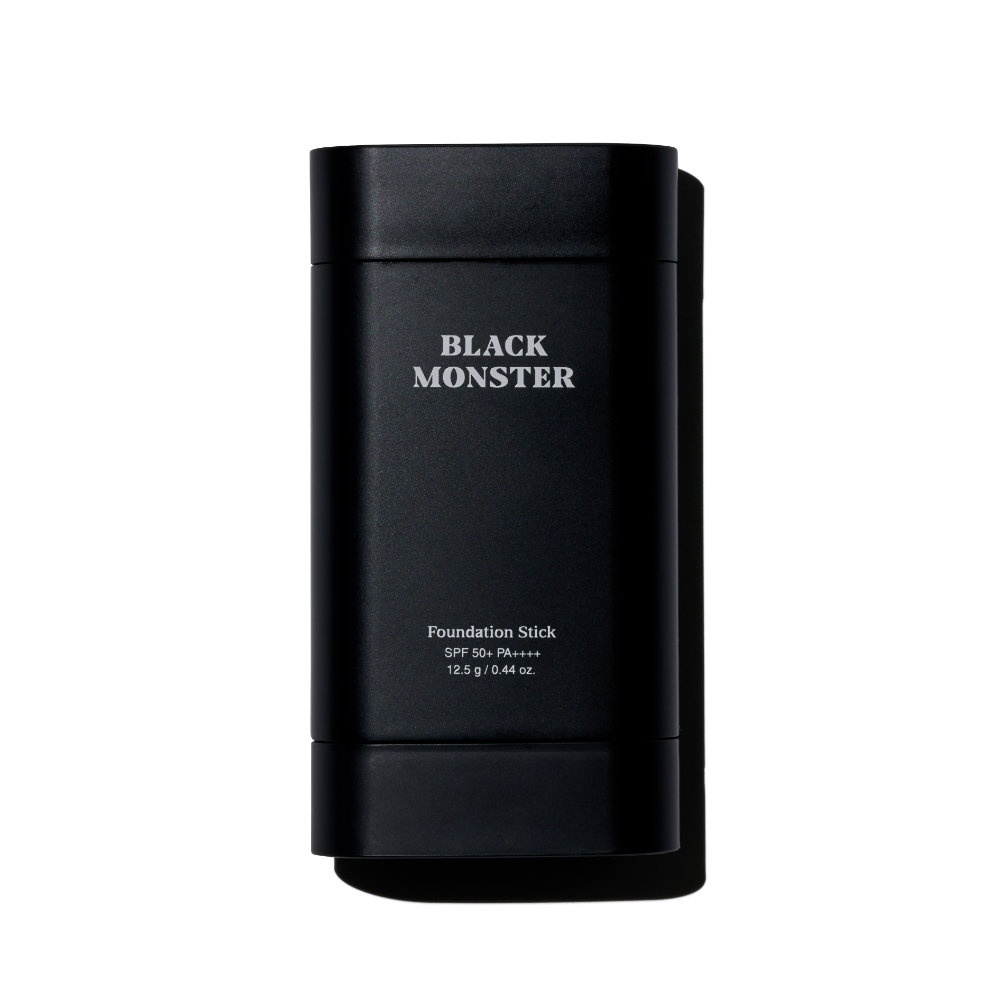 BLACK MONSTER Foundation Stick, flacon noir sur fond blanc; produit maquillage de la marque BLACK MONSTER.