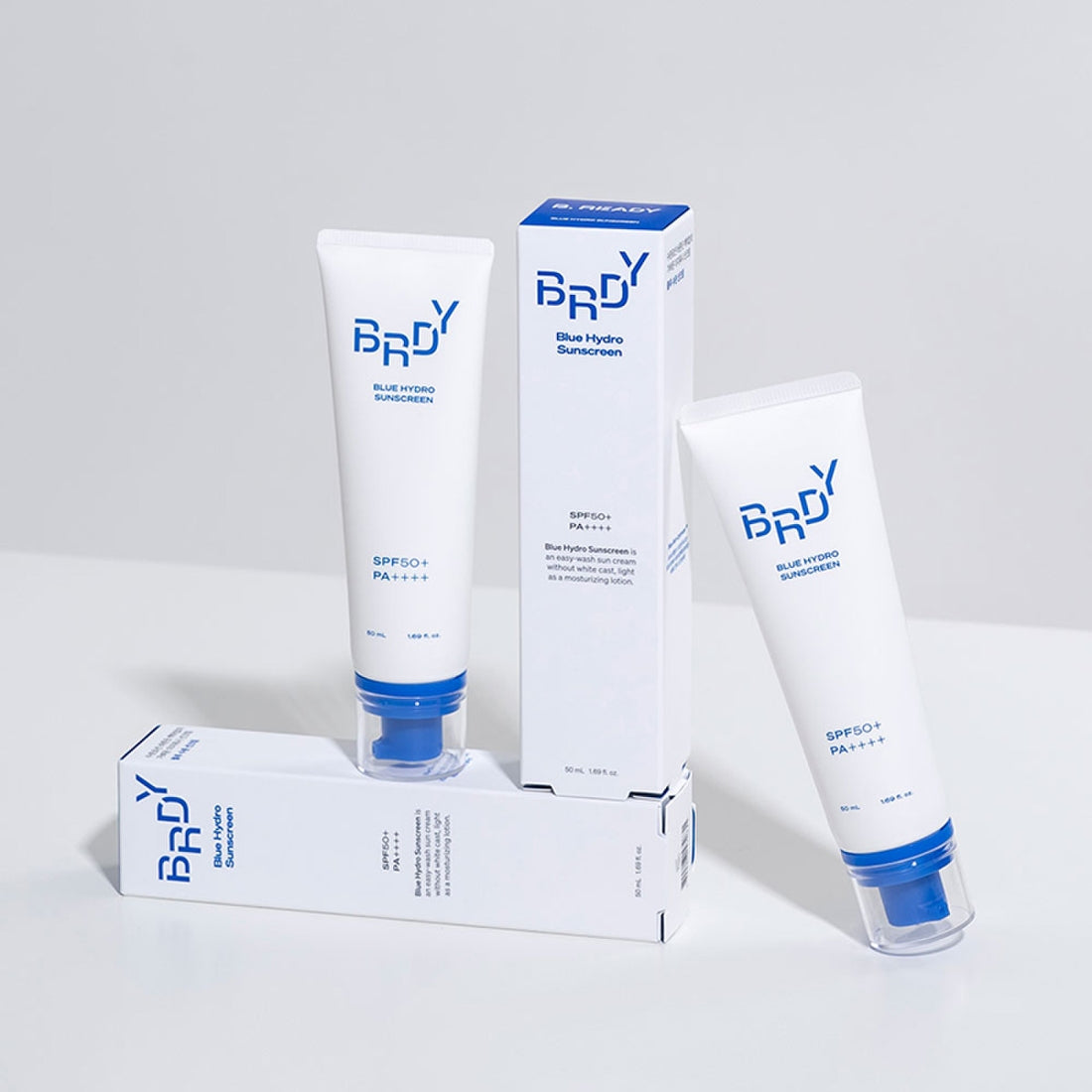 B.READY Blue Moisture Sun Cream SPF50+/PA++++ 50ml de la marque BE.READY, sur fond clair, pack et tube photo produit.
