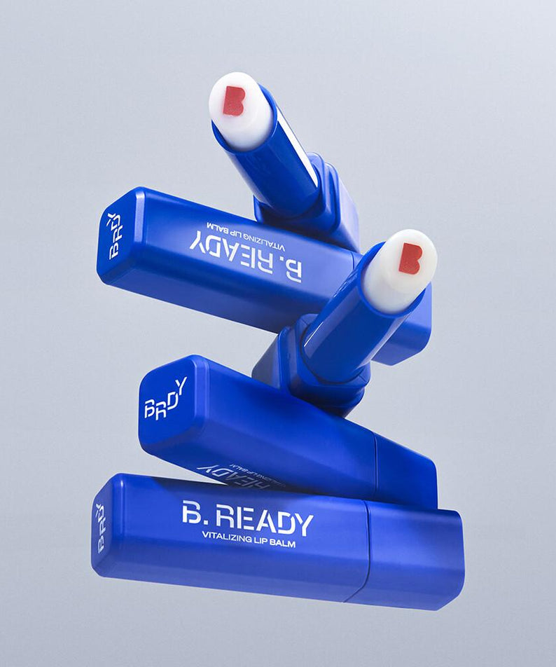 B.READY Vitalizing Lip Balm en bleu, hydratant pour lèvres vives, produit essentiel pour soins quotidiens, style énergique.