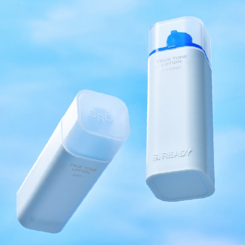 B.READY True Tone Lotion 2.0 40ml de marque B.READY, flacons blanc/bleu sur fond bleu ciel.
