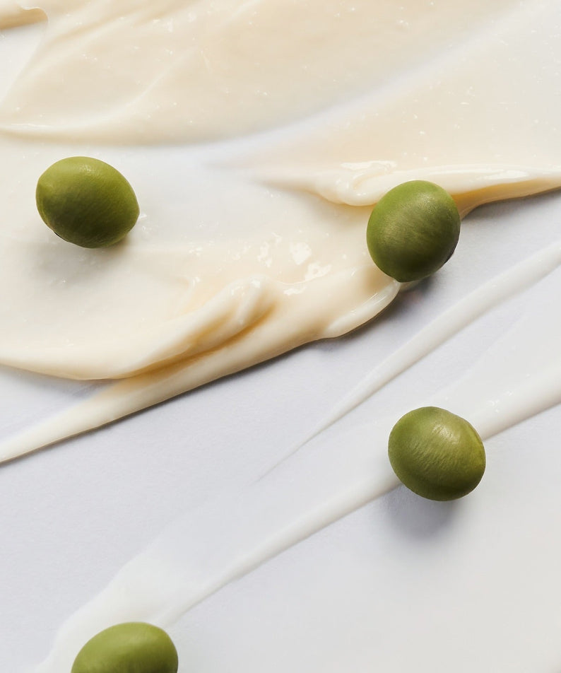 BRINGGREEN Blue Bean B5-PDRN Mild Lotion 230ml de BRINGGREEN, texture crème avec billes vertes sur fond clair.