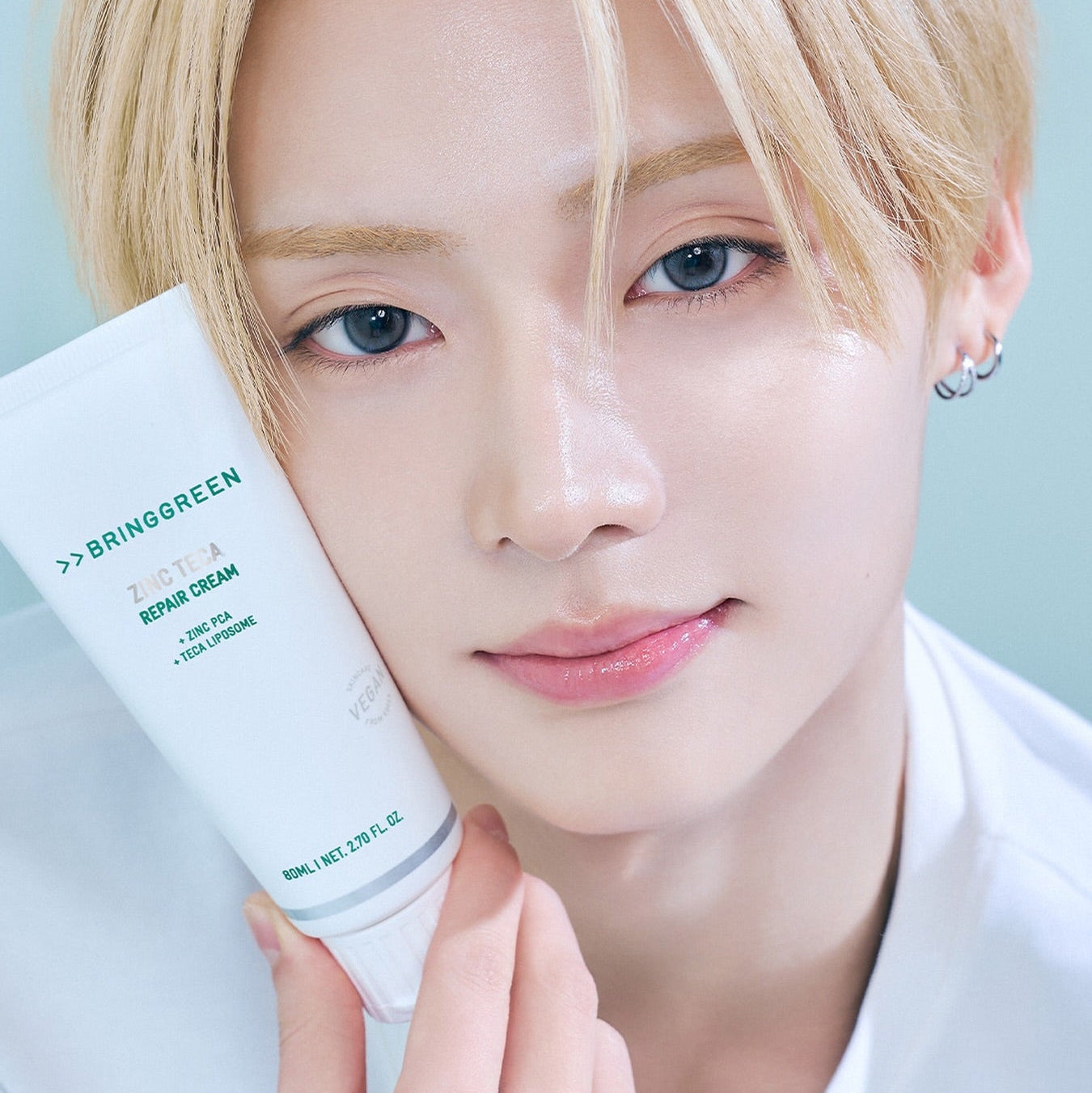 BRINGGREEN Zinc Teca Repair Blemish Cream 80ml de BRINGGREEN, tube présenté sur visage clair en gros plan (photo cosmétique).