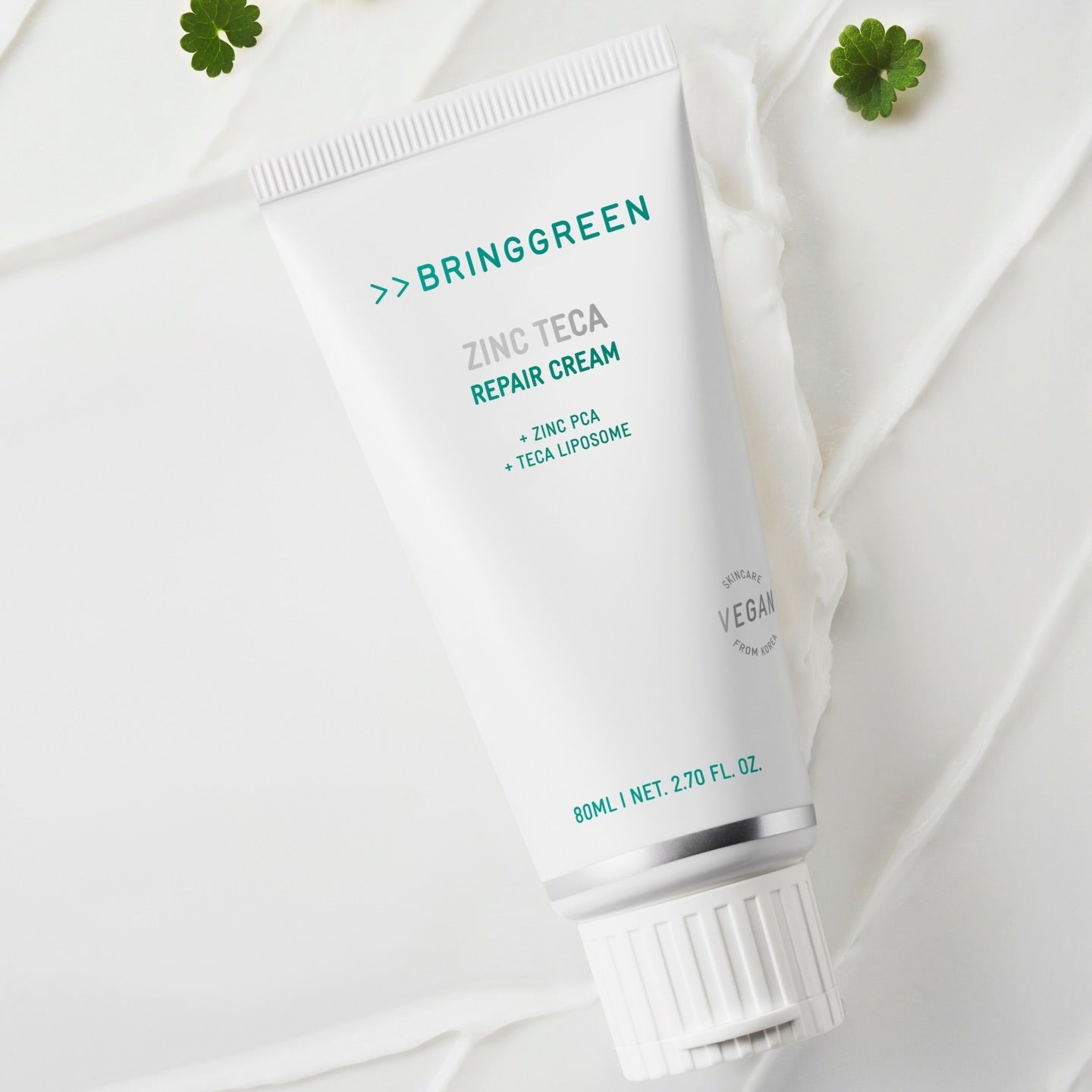 BRINGGREEN Zinc Teca Repair Blemish Cream 80ml, tube blanc sur fond clair avec trèfles; marque BRINGGREEN en visuel.