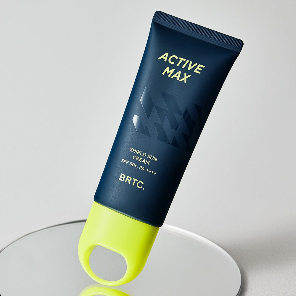 BRTC Homme Active Max Sheild Sunscreen 50ml de BRTC, tube bleu et vert sur fond clair, crème solaire SPF50+