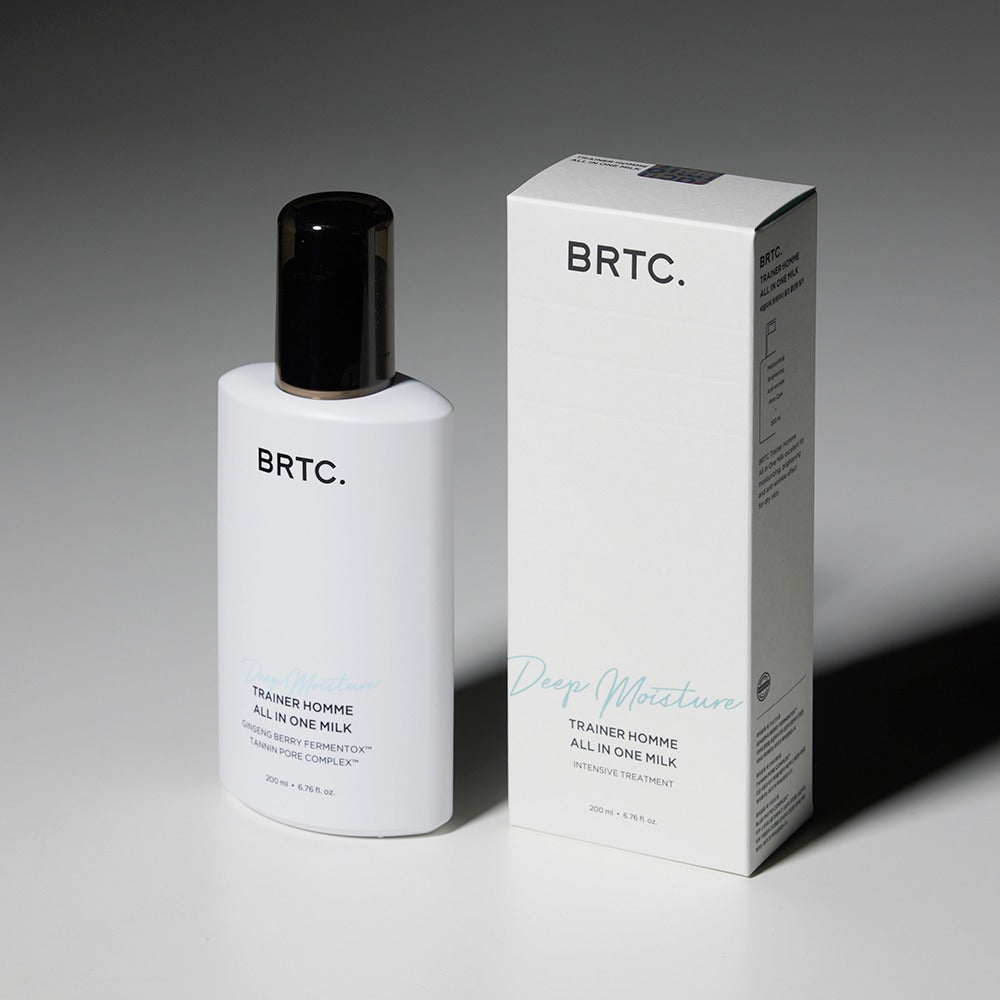 Décris l'image en français : BRTC Trainer Homme ALl-in-One Milk 200ml, flacon blanc et boîte BRTC sur fond gris.