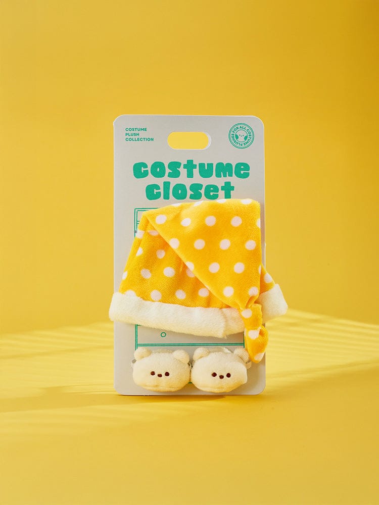 BT21 CHILL BREAK PLUSH CLOSET - HOMEWEAR : peluche sur blister costume jaune à pois, fond jaune, marque BT21/LINE FRIENDS