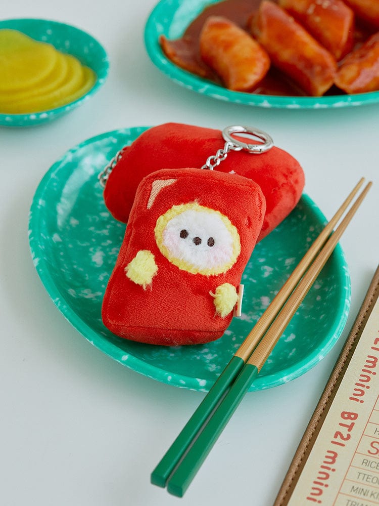 BT21 CHIMMY minini PLUSH KEYRING BUNSIK, porte-clés peluche CHIMMY sur plateau vert avec baguettes et snacks, style K-pop.