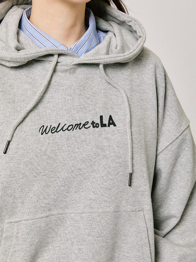 BT21 HOODED SWEATSHIRT 2024 F/W CITY EDITION (LA GRAY), sweat à capuche gris, logo “Welcome to LA”, mode street.