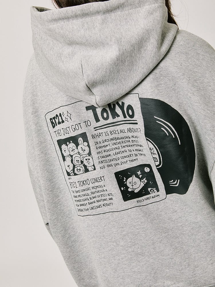 BT21 HOODED SWEATSHIRT 2024 F/W CITY EDITION (TOKYO GRAY) avec visuel Tokyo et personnages, hoodie gris officiel.