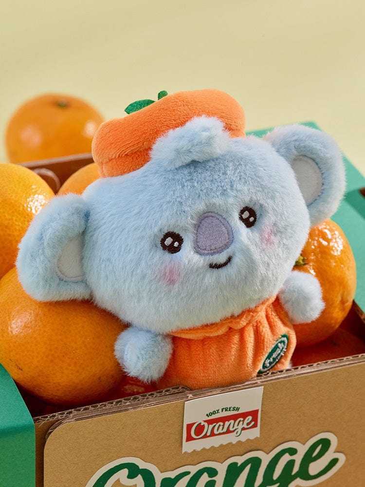 BT21 KOYA BABY PLUSH ORANGE PARTY, peluche KOYA orange et bleue LINE, photo en gros plan sur étagère