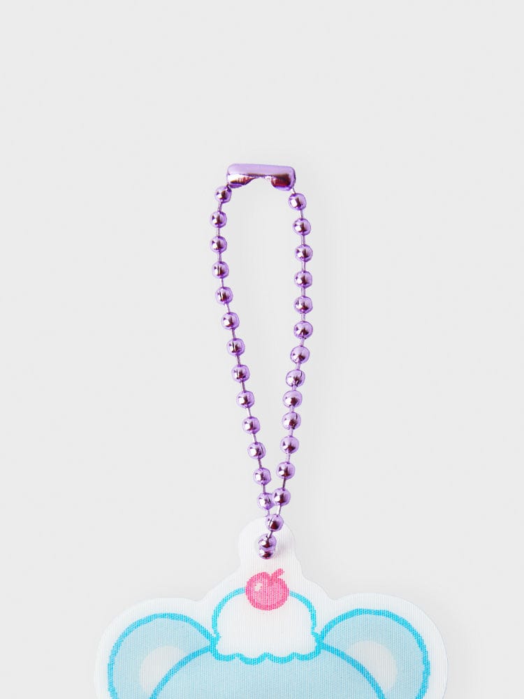 BT21 KOYA LENTICULAR 3D KEYRING ON THE CLOUD EDITION, porte-clés KOYA koala BT21 sur billes violettes, fond blanc.
