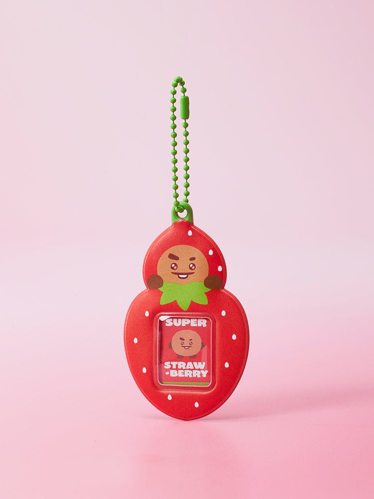 BT21 MINI PHOTO HOLDER KEYRING STRAWBERRY PARTY, porte-clés officiel BT21, devant fond rose, personnage fraise avec photo