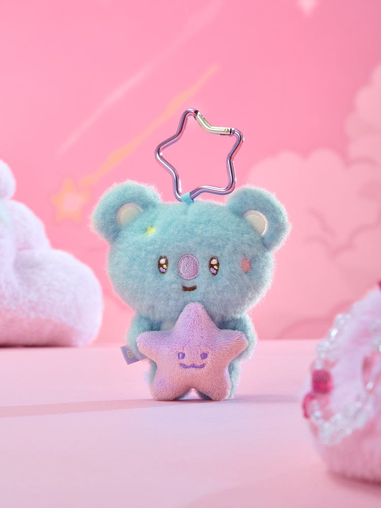 BT21 PURPLE STAR PLUSH KEYRING THE JOURNEY, porte-clés étoile violette en peluche BT21 avec LINE FRIENDS, fond rose kawaii