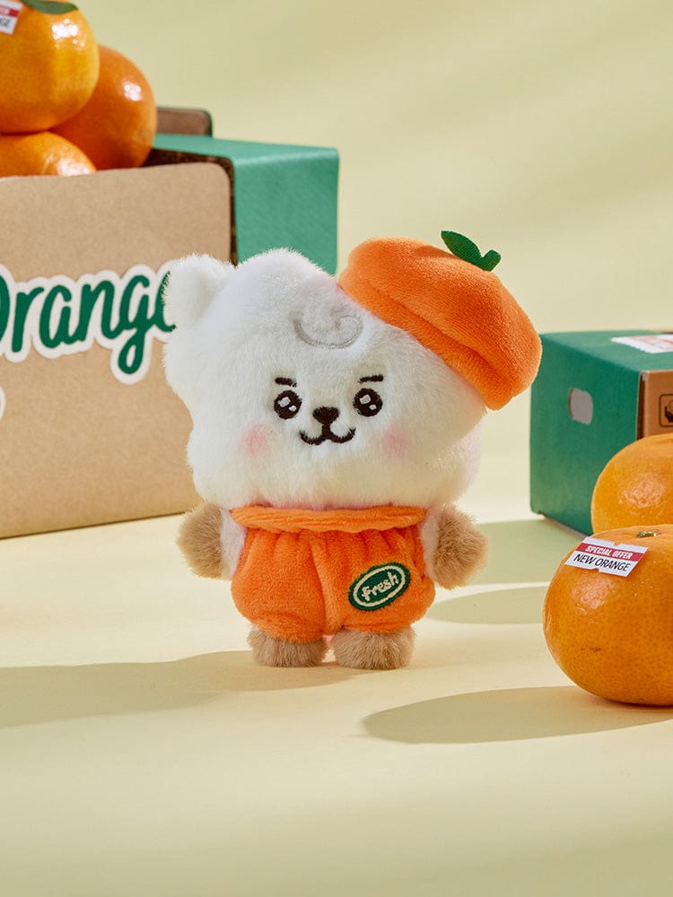 BT21 RJ BABY PLUSH ORANGE PARTY : peluche officielle LINE FRIENDS alpaga RJ orange, en décor “party” sur fond beige.