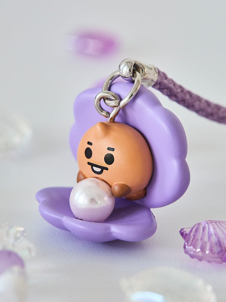 BT21 SHOOKY BABY PEARL FIGURINE STRAP LINE FRIENDS, porte-clés en figurine SHOOKY avec perle blanche, sur fond pastel violet.