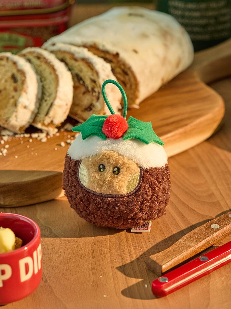 BT21 SHOOKY mini minini ORNAMENT PLUSH KEYRING PETITE HOLIDAY, porte-clés en peluche SHOOKY avec décor de fête sur table.