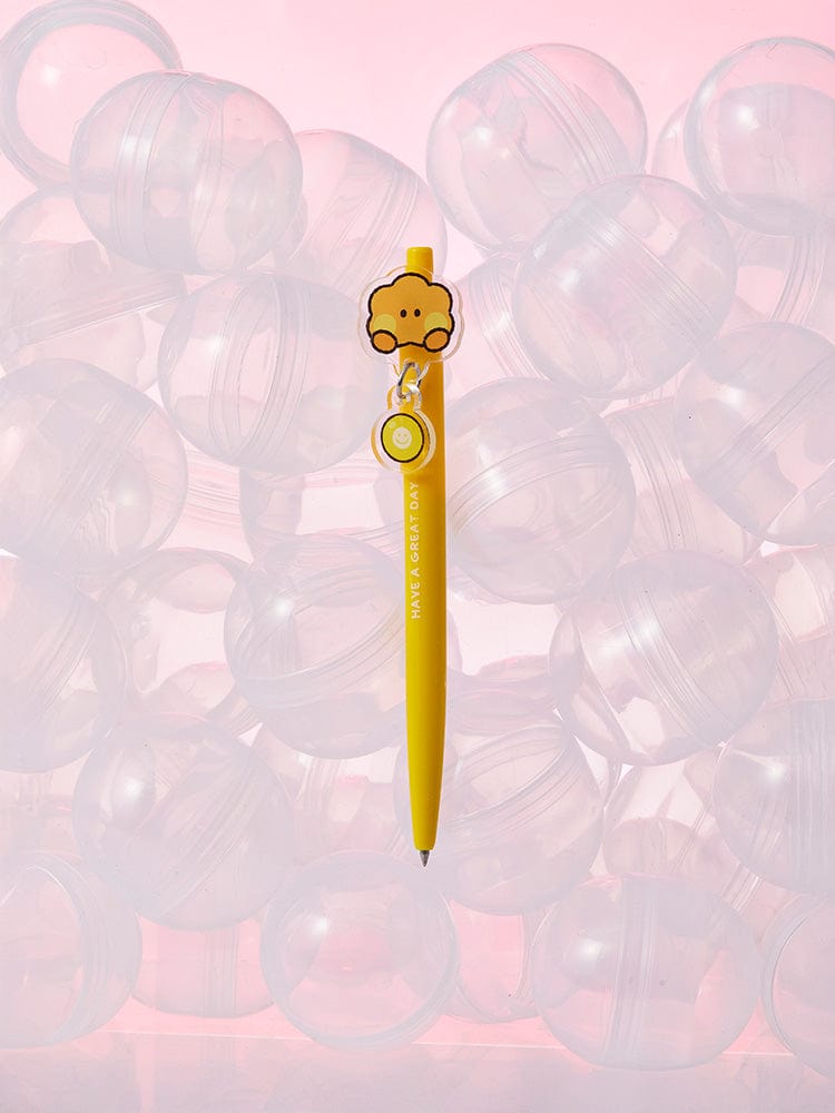 BT21 SHOOKY minini GEL PEN LUCKY GATCHA, stylo gel jaune officiel LINE FRIENDS, illustré SHOOKY sur fond rose flou
