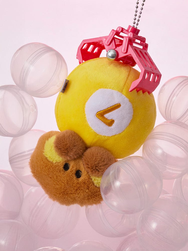 BT21 SHOOKY minini PLUSH LUCKY GATCHA : peluche porte-clés SHOOKY jaune avec accessoires sur fond rose