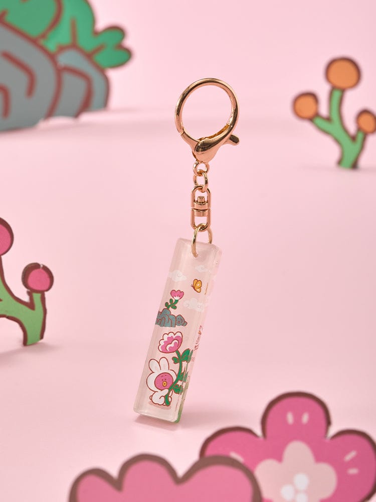 BT21 STICK ACRYLIC KEYRING K-TOKKI : porte-clés acrylique K-Tokki officiel, sur fond rose avec personnages BT21.