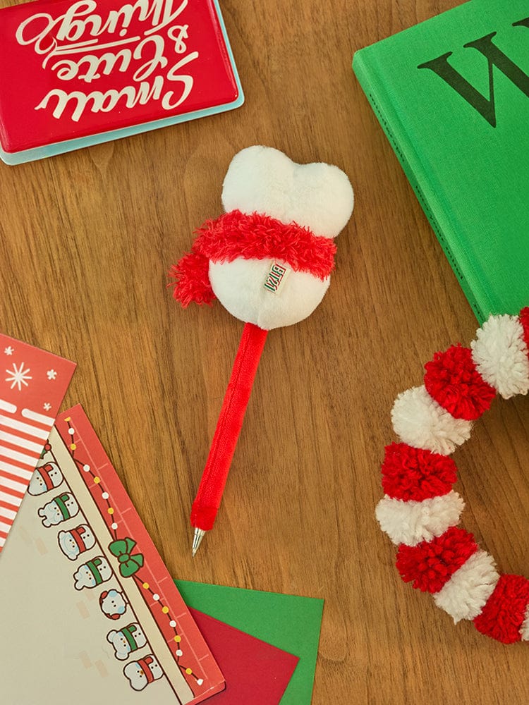 BT21 TATA mini minini SNOWMAN PLUSH GEL PEN PETITE HOLIDAY : stylo peluche flocon rouge/blanc sur bureau bois, décor fête.