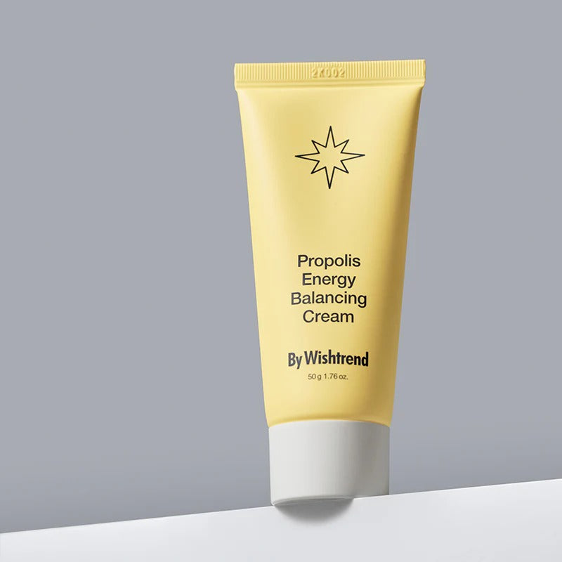 BY WISHTREND Propolis Energy Balancing Cream 50g, tube jaune crème sur fond gris clair, marque By Wishtrend en vue.