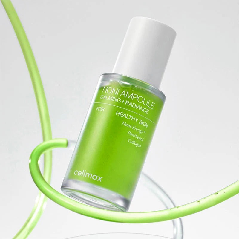 CELIMAX Noni Ampoule Calming+Radiance 30ml, flacon vert sur fond clair, contexte beauté apaisante et éclatante.