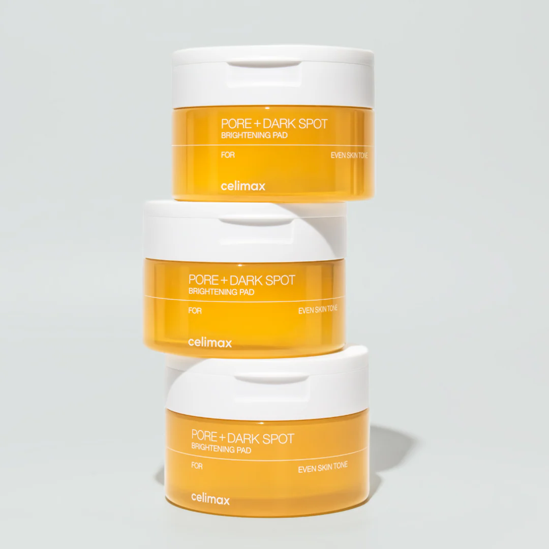 CELIMAX Pore Dark Spot Brightening Pad 40ea : pots orange/white sur fond clair, pour atténuer les taches.