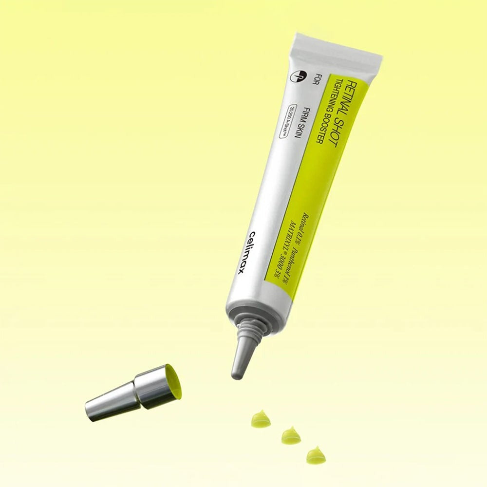 CELIMAX Retinol Shot Tightening Booster 15ml de CELIMAX, tube sur fond jaune, gouttes de texture verte.