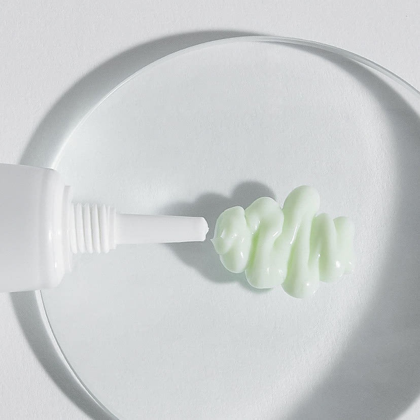 CELIMAX The Real Noni Ultimate Eye Cream 20ml, crème contour des yeux, tube blanc et texture verte sur fond clair.