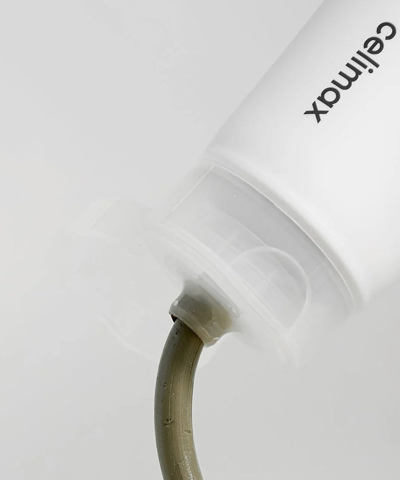 Tube de CELIMAX The Real Noni Refresh Clay Mask 120g montrant une texture appliquée.